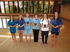 Girls 100 breaststroke champs - 1st far right